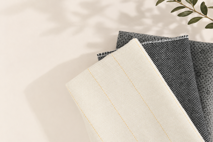 Primary tufting cloth, woven backing fabric and anti-slip rug backing arranged together